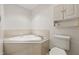 Bright bathroom with a tiled-in tub and updated fixtures at 959 Harvest Ridge Dr, Avon, IN 46123