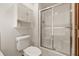 Clean bathroom featuring a glass-enclosed shower and built-in storage at 959 Harvest Ridge Dr, Avon, IN 46123
