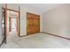 Well-lit bedroom with a bifold closet door and view to hallway at 959 Harvest Ridge Dr, Avon, IN 46123