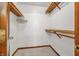 Walk-in closet featuring wood shelving and ample storage space at 959 Harvest Ridge Dr, Avon, IN 46123