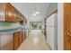 Traditional kitchen with wood cabinets and bright appliances creating an inviting space with views to the yard at 959 Harvest Ridge Dr, Avon, IN 46123