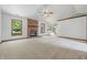 Spacious living room features a brick fireplace, neutral carpet, and bright windows with an airy feel at 959 Harvest Ridge Dr, Avon, IN 46123
