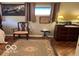 Bedroom with a cozy chair, classic decor, and wood floors at 9701 Hamilton Hills Ln, Fishers, IN 46038