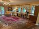Cozy living room with classic furnishings, hardwood floors, and views to the outdoors at 9701 Hamilton Hills Ln, Fishers, IN 46038