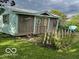 This shed has a nautical theme and sits in a well maintained yard at 9701 Hamilton Hills Ln, Fishers, IN 46038