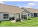 Beautiful backyard with a screened-in porch and well-manicured lawn for outdoor enjoyment at 104 Perlican Dr, Cicero, IN 46034