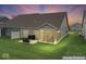 Backyard view of the home with a patio and screened-in sunroom at 104 Perlican Dr, Cicero, IN 46034