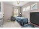 Bedroom featuring modern window configuration, a single bed, and neutral wall color at 104 Perlican Dr, Cicero, IN 46034