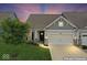 Charming home exterior with a well-manicured lawn and a two-car garage at 104 Perlican Dr, Cicero, IN 46034