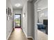 Inviting hallway with wood floors leading to a bright, open living space at 104 Perlican Dr, Cicero, IN 46034