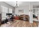 Well-lit home office featuring a piano and a work station with dual monitors at 104 Perlican Dr, Cicero, IN 46034