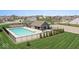 Community pool with a covered area and playground offers a relaxing and fun environment at 104 Perlican Dr, Cicero, IN 46034