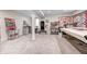 Spacious basement area with white walls, sewing space and carpeted floors at 10479 Dusty Rose Dr, Zionsville, IN 46077