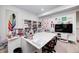Basement craft room with white cabinets, tv and plenty of sewing space at 10479 Dusty Rose Dr, Zionsville, IN 46077