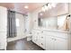 Bathroom featuring a dual sink vanity, tile flooring and shower with subway tiles at 10479 Dusty Rose Dr, Zionsville, IN 46077