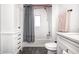 Bathroom featuring a shower with white subway tiles, and a custom vanity at 10479 Dusty Rose Dr, Zionsville, IN 46077