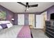 Stylish bedroom featuring ensuite bathroom access and a large comfortable bed at 10479 Dusty Rose Dr, Zionsville, IN 46077