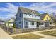 Charming two-story home featuring blue siding and a well-kept lawn at 10479 Dusty Rose Dr, Zionsville, IN 46077