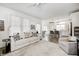 Open-concept living and kitchen area with modern decor, hardwood floors, and ample space for entertaining at 10479 Dusty Rose Dr, Zionsville, IN 46077