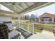 Inviting porch with wicker furniture overlooking colorful homes at 10479 Dusty Rose Dr, Zionsville, IN 46077