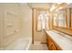 Neutral bathroom features a vanity, sink, and window at 105 Golf Club Rd, Anderson, IN 46011