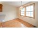 Bright dining area with hardwood floors and natural light from two windows at 105 Golf Club Rd, Anderson, IN 46011