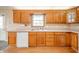 Functional kitchen featuring wood cabinets and modern appliances at 105 Golf Club Rd, Anderson, IN 46011