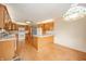 Open kitchen with light wood cabinetry and breakfast bar, perfect for entertaining at 105 Golf Club Rd, Anderson, IN 46011