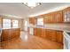 Well-lit kitchen featuring wood cabinets and ample countertop space at 105 Golf Club Rd, Anderson, IN 46011