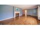 Spacious living room boasting hardwood floors and a cozy fireplace at 105 Golf Club Rd, Anderson, IN 46011