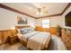 Charming main bedroom with wood accents, soft lighting, and a decorative blue and beige color scheme at 105 Golf Club Rd, Anderson, IN 46011