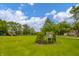 Green neighborhood park features mature trees, playground, and signage at 105 Golf Club Rd, Anderson, IN 46011