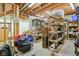 Unfinished basement with exposed duct work, shelving, and room for storage at 1121 N Cambridge Ct, Greenfield, IN 46140