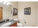Bathroom with a vanity with granite countertop, toilet, and artwork at 1121 N Cambridge Ct, Greenfield, IN 46140