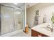 Functional bathroom with tiled floor, a shower with glass doors, a toilet, and a single sink vanity with a wood cabinet at 1121 N Cambridge Ct, Greenfield, IN 46140