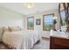 Comfortable bedroom with two windows, carpeted floor, and a dresser with a lamp, creating a cozy and inviting space at 1121 N Cambridge Ct, Greenfield, IN 46140