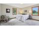 Bedroom with a comfortable bed, two windows, and neutral decor at 1121 N Cambridge Ct, Greenfield, IN 46140