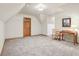 Neutral bonus room with plush carpet, lots of natural light, and a simple wooden desk at 1121 N Cambridge Ct, Greenfield, IN 46140