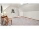 Spacious bonus room with neutral paint, plush carpet, and a vintage wooden desk at 1121 N Cambridge Ct, Greenfield, IN 46140
