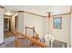 View of the foyer featuring wood trim, light fixture, staircase and hall leading to other rooms of the house at 1121 N Cambridge Ct, Greenfield, IN 46140