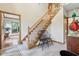 Inviting foyer with a staircase, tile flooring, and access to multiple rooms creating a welcoming entrance at 1121 N Cambridge Ct, Greenfield, IN 46140
