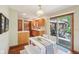 Bright eat-in kitchen with access to the patio and ample cabinet space at 1121 N Cambridge Ct, Greenfield, IN 46140