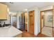 Well-lit kitchen with stainless steel refrigerator, light countertops, wood cabinets, and gas range at 1121 N Cambridge Ct, Greenfield, IN 46140