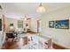 Open-concept living area featuring a ceiling fan, breakfast nook, and natural light at 1121 N Cambridge Ct, Greenfield, IN 46140