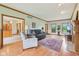 Spacious living room featuring hardwood floors, comfortable seating, and plenty of natural light at 1121 N Cambridge Ct, Greenfield, IN 46140