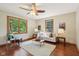 Cozy living room with hardwood floors, ceiling fan, area rug and an abundance of natural light at 1121 N Cambridge Ct, Greenfield, IN 46140