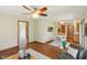 Living room with hardwood floors, ceiling fan, and eat-in dining area at 1121 N Cambridge Ct, Greenfield, IN 46140