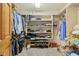 Spacious walk-in closet with organized shelving, hanging rods, shoe racks, and ample storage for clothing and accessories at 1121 N Cambridge Ct, Greenfield, IN 46140
