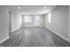 Bright basement featuring neutral walls, recessed lighting, and gray vinyl flooring at 1141 Temperance Ave, Indianapolis, IN 46203