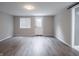 Basement area with neutral walls and wood-look flooring at 1141 Temperance Ave, Indianapolis, IN 46203